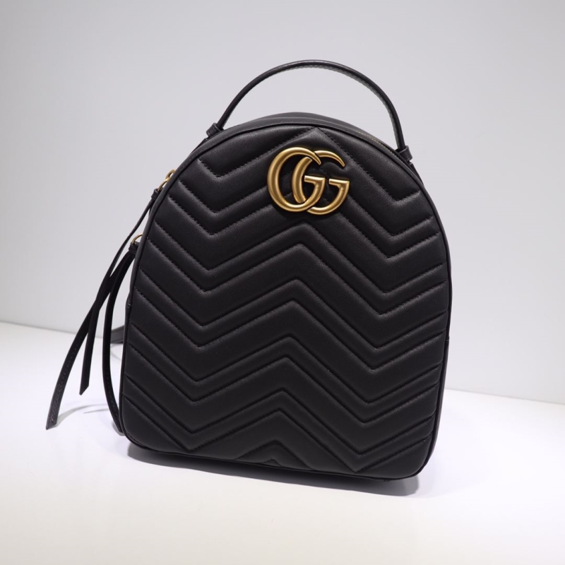 G*u*i backpacks